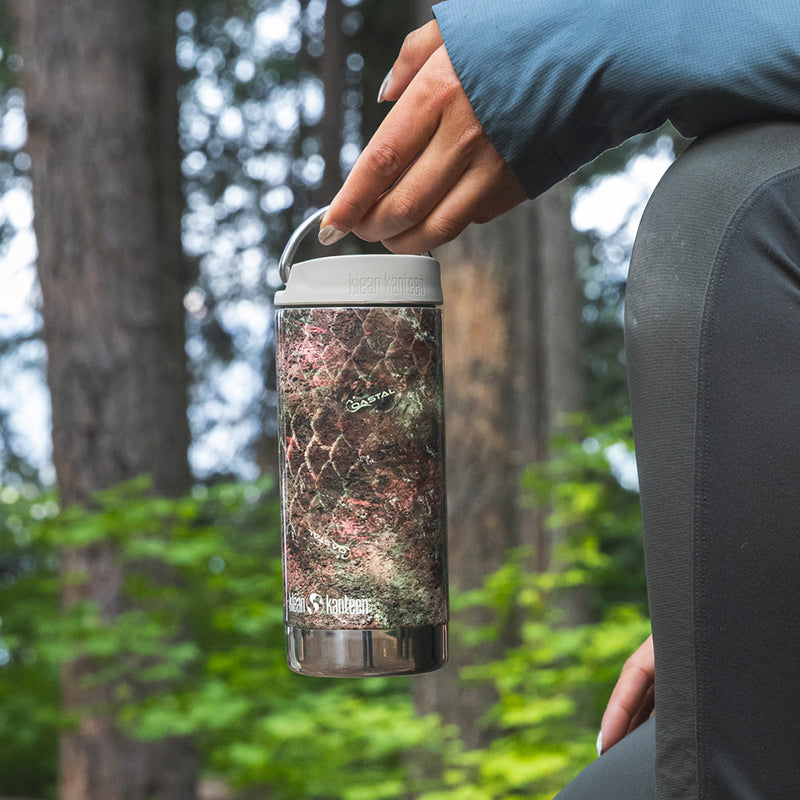 12oz-tkwide-with-twist-cap-mossy-oak-k9 12oz_tumbler_mossyoak_rainbowtrout_hand_closeup_square.jpg