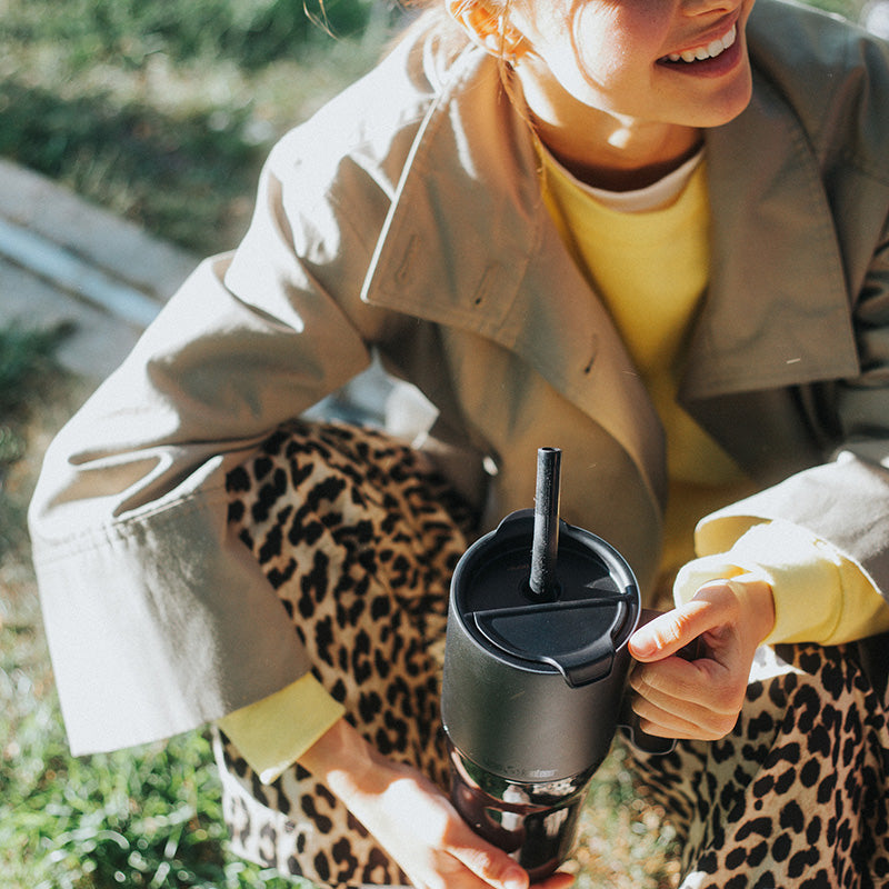 26oz-rise-tumbler-with-straw-lid-q2 26oz_rise_tumbler_black_woman_topview_square.jpg