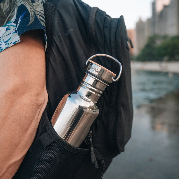 27oz-reflect-with-bamboo-cap-r5 K27SSLRF-MS-BAMBOO_reflect-bottle_backpack_lifestyle.jpg